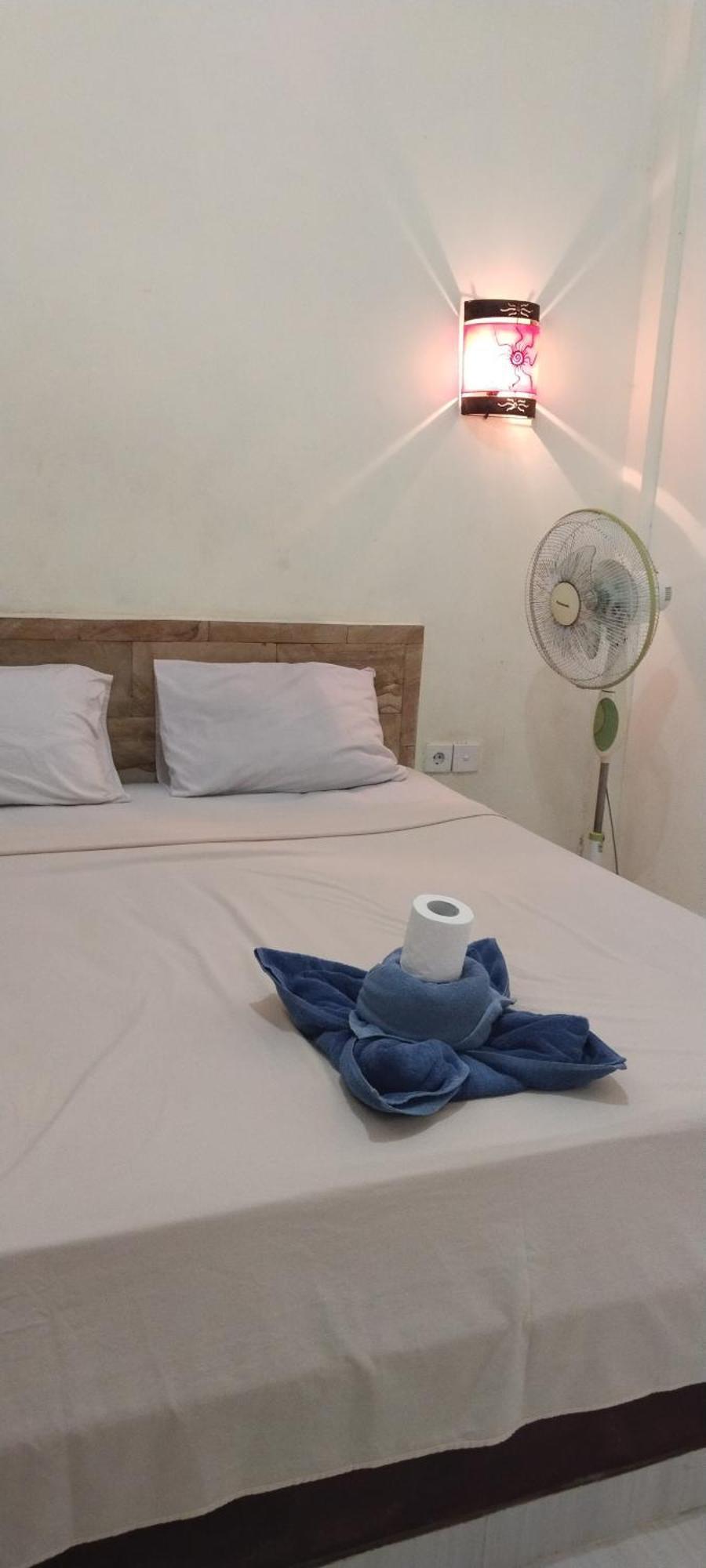 Amed Stop Inn Homestay, Rooftop Restaurant And Bar Exterior foto