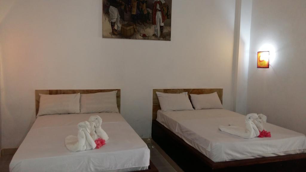 Amed Stop Inn Homestay, Rooftop Restaurant And Bar Exterior foto