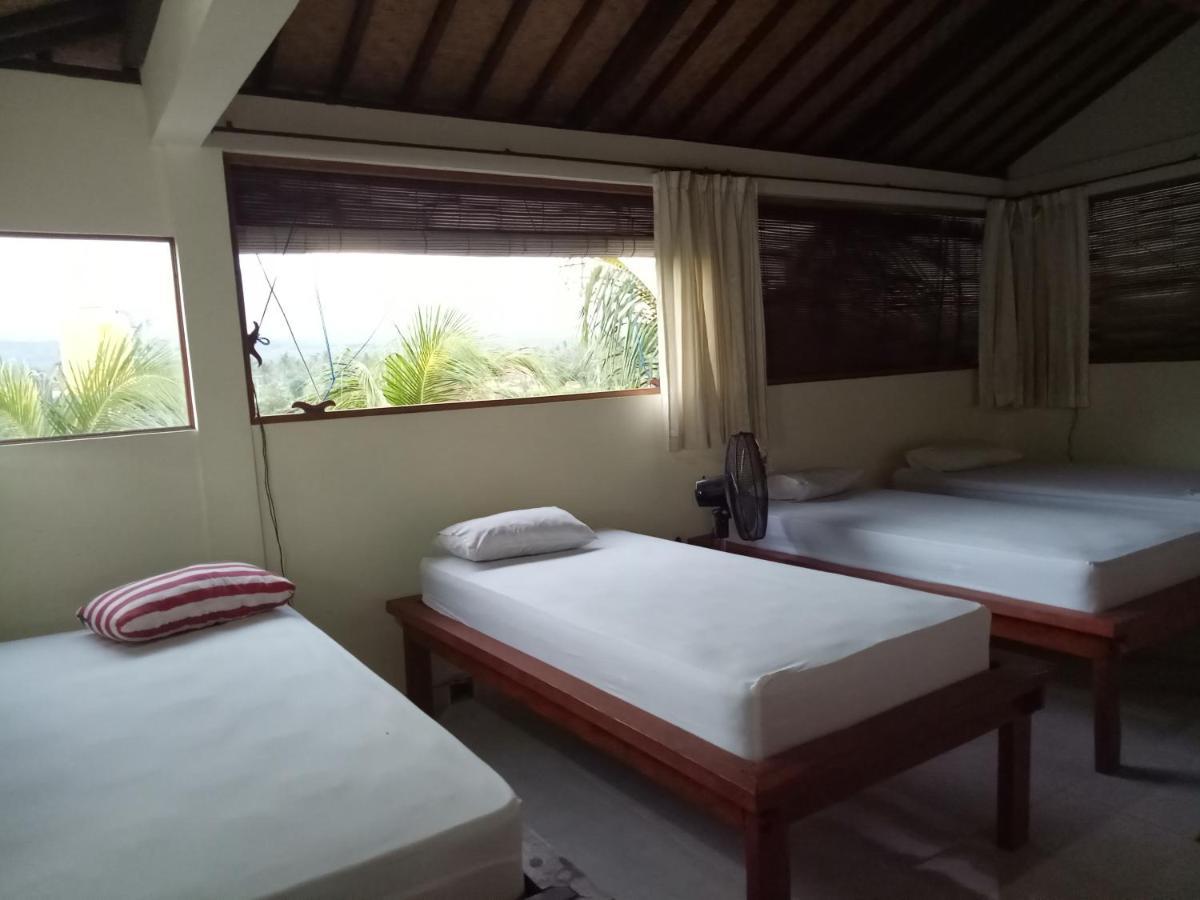 Amed Stop Inn Homestay, Rooftop Restaurant And Bar Exterior foto