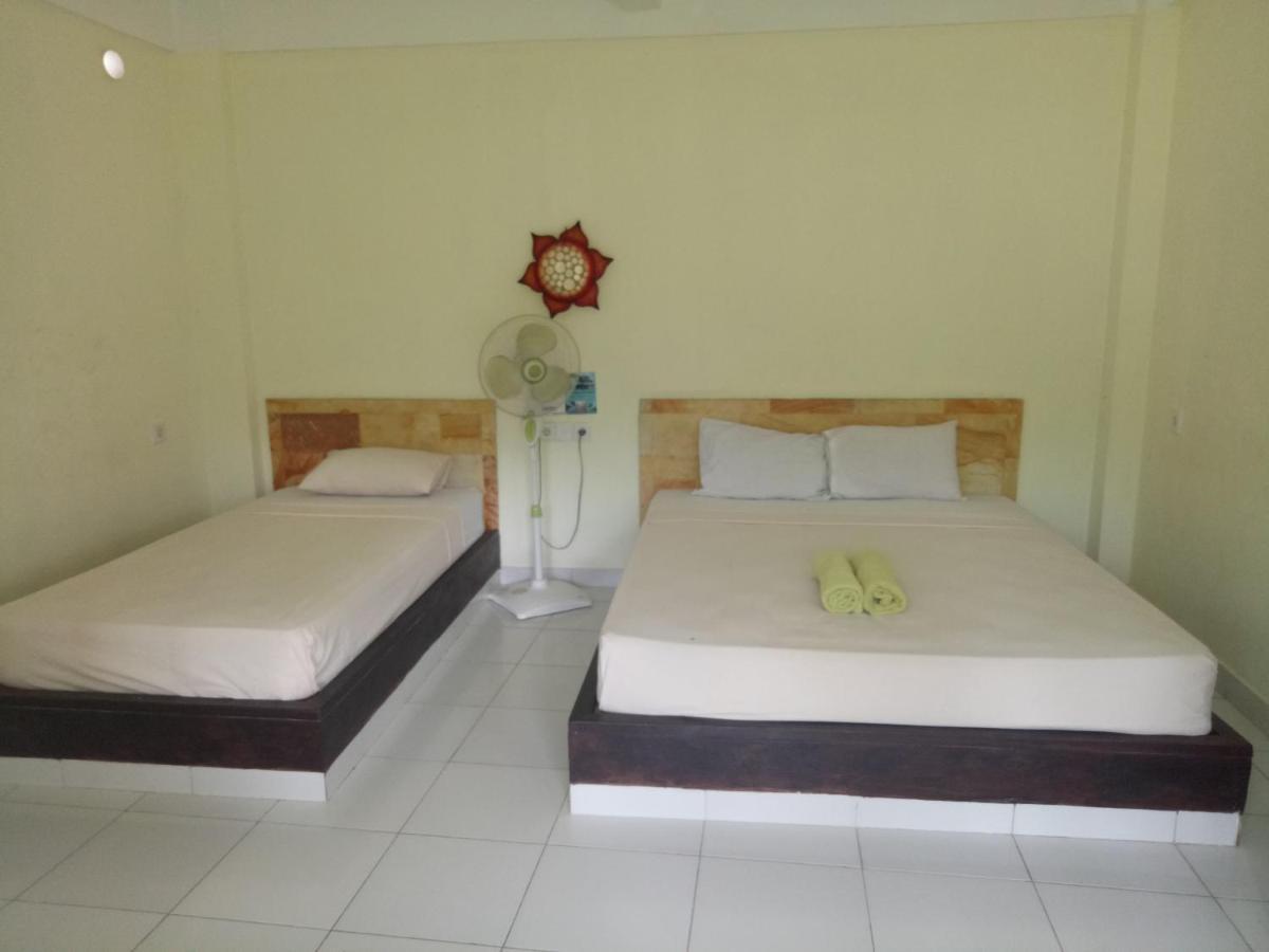 Amed Stop Inn Homestay, Rooftop Restaurant And Bar Exterior foto